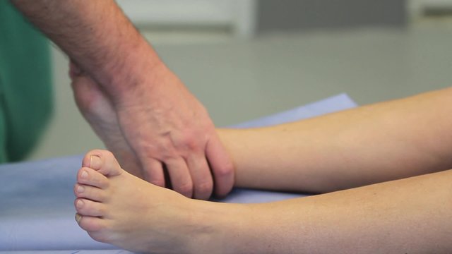 Legs Comparison

surgeon evaluates and compares two legs of patient before the surgery of HIP replacement. He takes, moves, bends and unbends right leg (CU, MS).