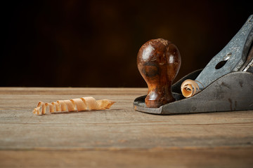 Hand plane on a wooden workbench.