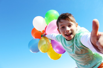 boy with colorfull balloons