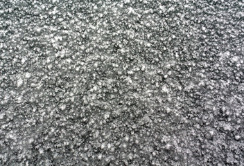 Snow and ice frost on car glass.
