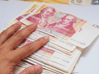 50 pound money array in hand
