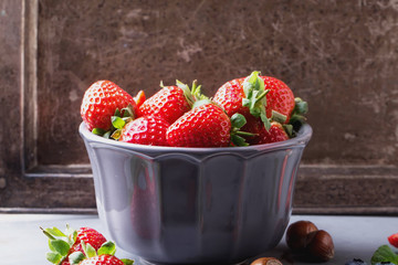 Strawberries and Blueberries on metal background