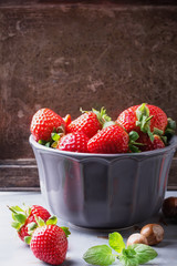 Strawberries and Blueberries on metal background