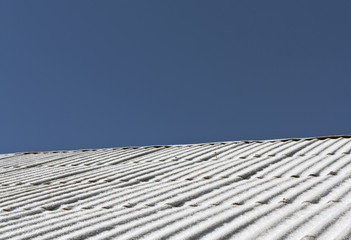 Snow on slate roof texture.