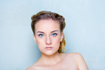Naklejka premium Beauty shooting of the girl on a blue background