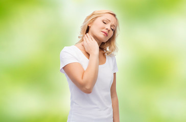 Naklejka premium unhappy woman suffering from neck pain