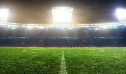 Obraz premium Soccer ball on the field of stadium