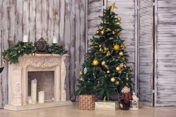 Fototapeta na wymiar New Year's interior with a fir-tree and fireplace