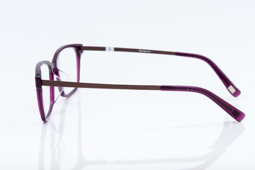 purple glasses on white background