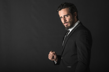 Business bearded man on black backgroung 