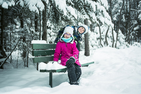 Little girl and boy in winter season