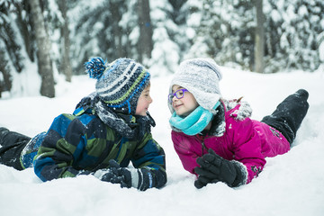 Fototapeta na wymiar Little girl and boy in winter season