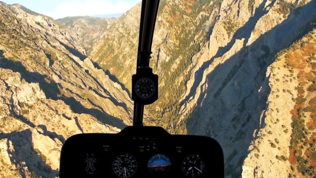 Aerial shot from chopper cockpit of rocky mountains in Utah.