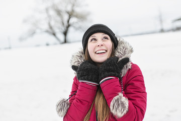 winter portrait of cute pretty young girl 