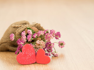 Valentines day background with red hearts on wood floor. Love and Valentine concept.
