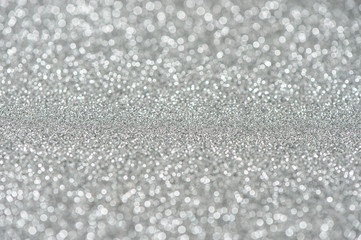 Glitter and glow. Shiny silver background. Abstract texture