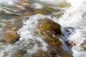rough water in the mountain river water as a background