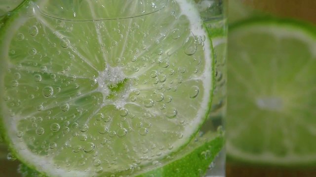 Glass With Lime And Sparkling Water 
