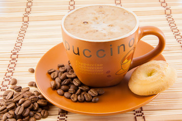 cup of cappuccino and cookies