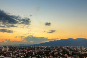 Fototapeta na wymiar City and mountain in evening