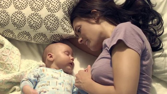 Royalty Free Stock Footage of Baby and mother in bed.