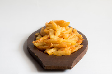 French fries on a wooden tray