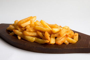 French fries on a wooden tray