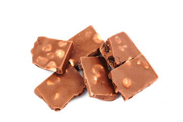 Broken milk chocolate bar with nuts, isolated on white background, top view
