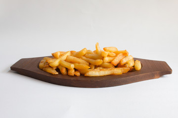 French fries on a wooden tray