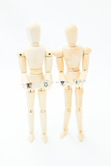 loving couple holding the word love with their hands and their hearts to their feet