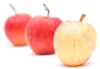 three apples on a white background