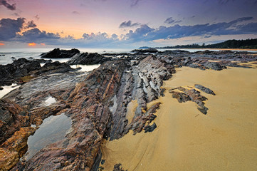 Stunning time lapse during  sunrise at rocky beach near Tanjung