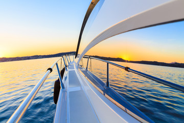luxury motoryacht at sunset - 99955275