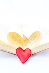 open book and forming a heart with their central leaves