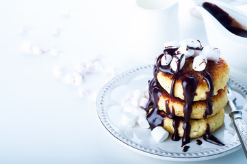 Syrniki cheese pancakes with sour cream 