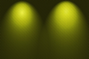 spotlight on yellow carbon fiber background.