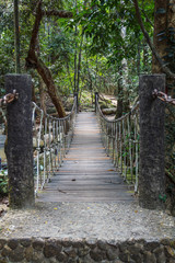 The very old hanging footbridge across a small river