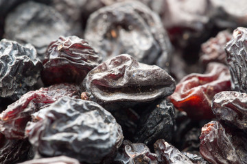 Black raisins as background. macro