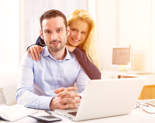 Attractive couple doing administrative paperwork