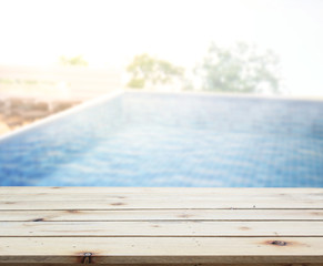 Wood Table Top of Background and Pool
