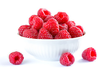 Big Pile of Fresh Raspberries in the White Bowl Isolated on White Background