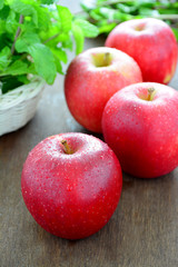 Red apples on wooden.