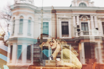 Fototapeta na wymiar Couple in love drinking coffee in coffee shop