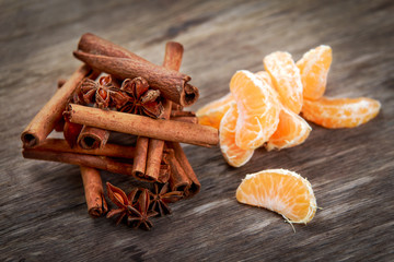 Cinnamon sticks and anice on wooden table. selected focus