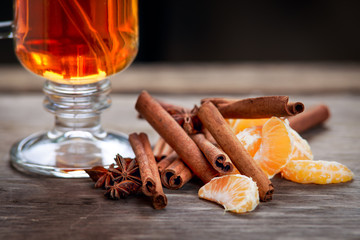 Hot Drink with cinnamon sticks and  tangerine.