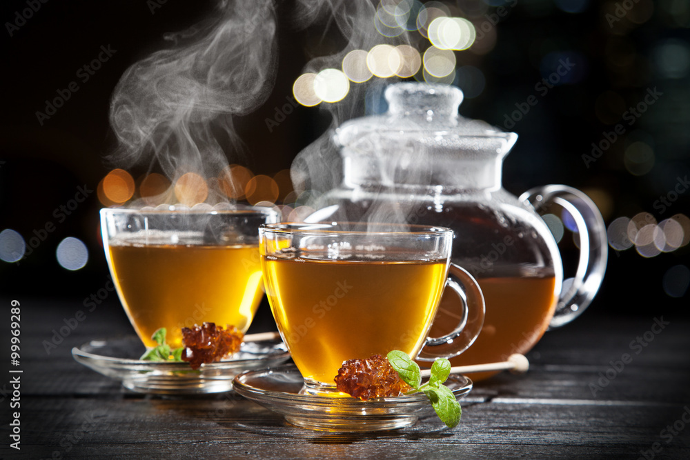 Wall mural Cup of tea on dark background