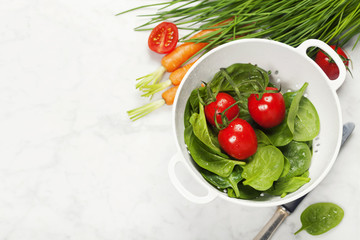 fresh organic garden vegetables in colander