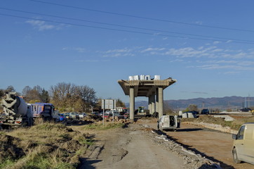 Part from bridge above new construction of road with rows of cars, Benkovski, Sofia 
