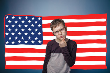 adolescent  the boy in glasses frowned American flag USA