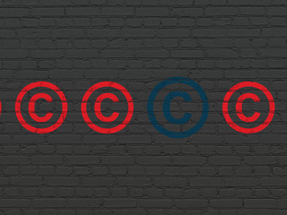 Law concept: copyright icon on wall background